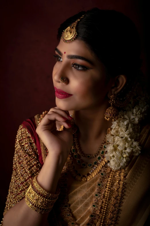 a beautiful woman wearing a jewelry is standing