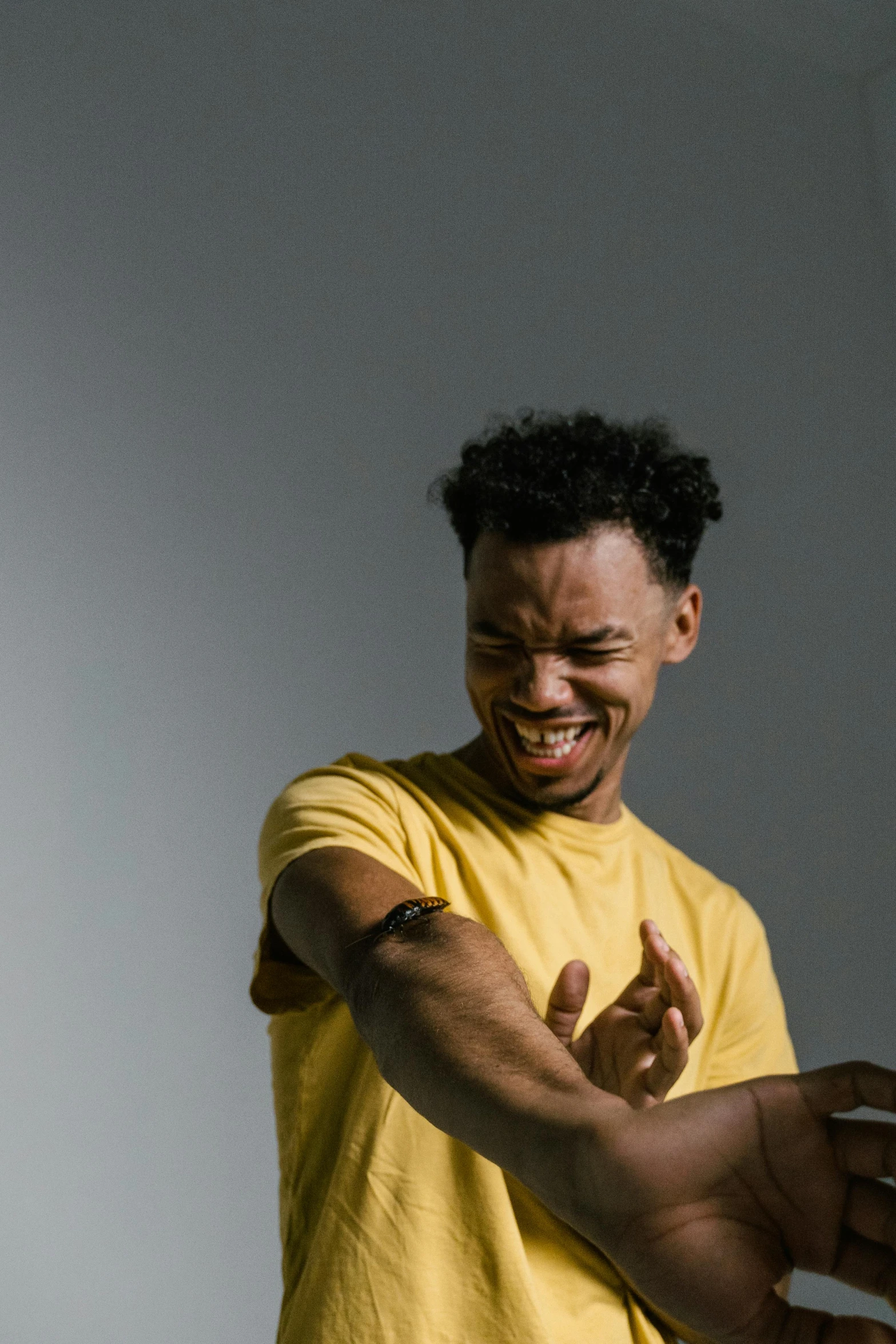 a person showing off his arm with both hands