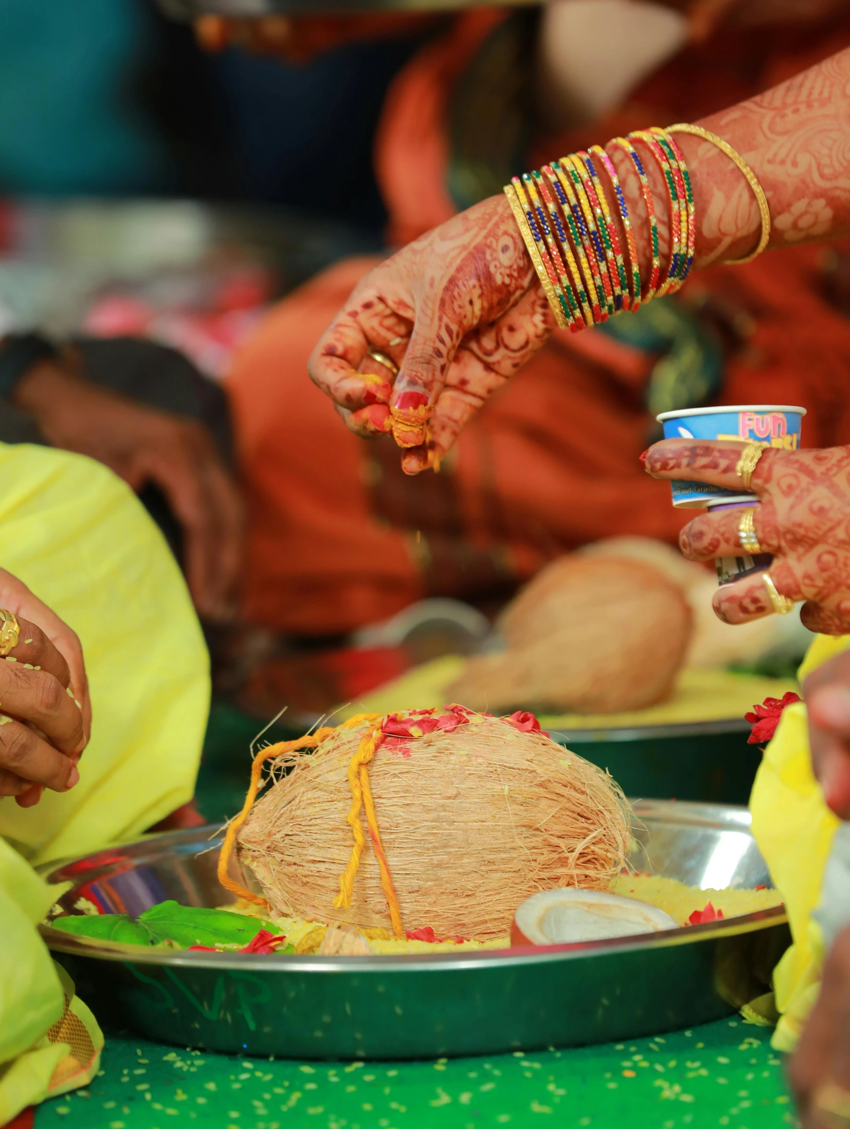 two women with hands putting celets on their wrists