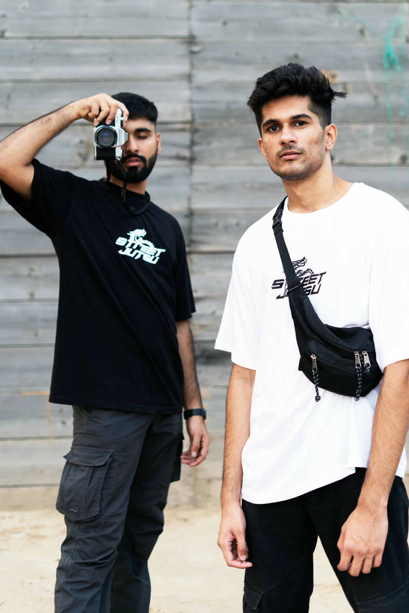 two guys with cameras on their necks