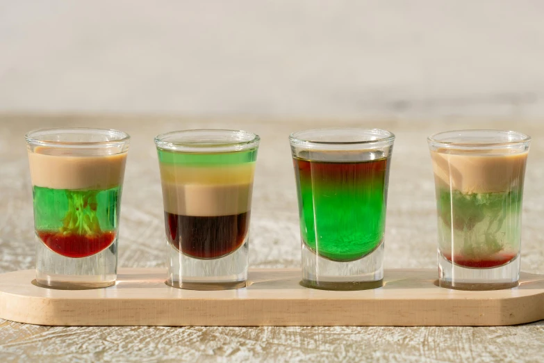 a set of four glasses in different colors