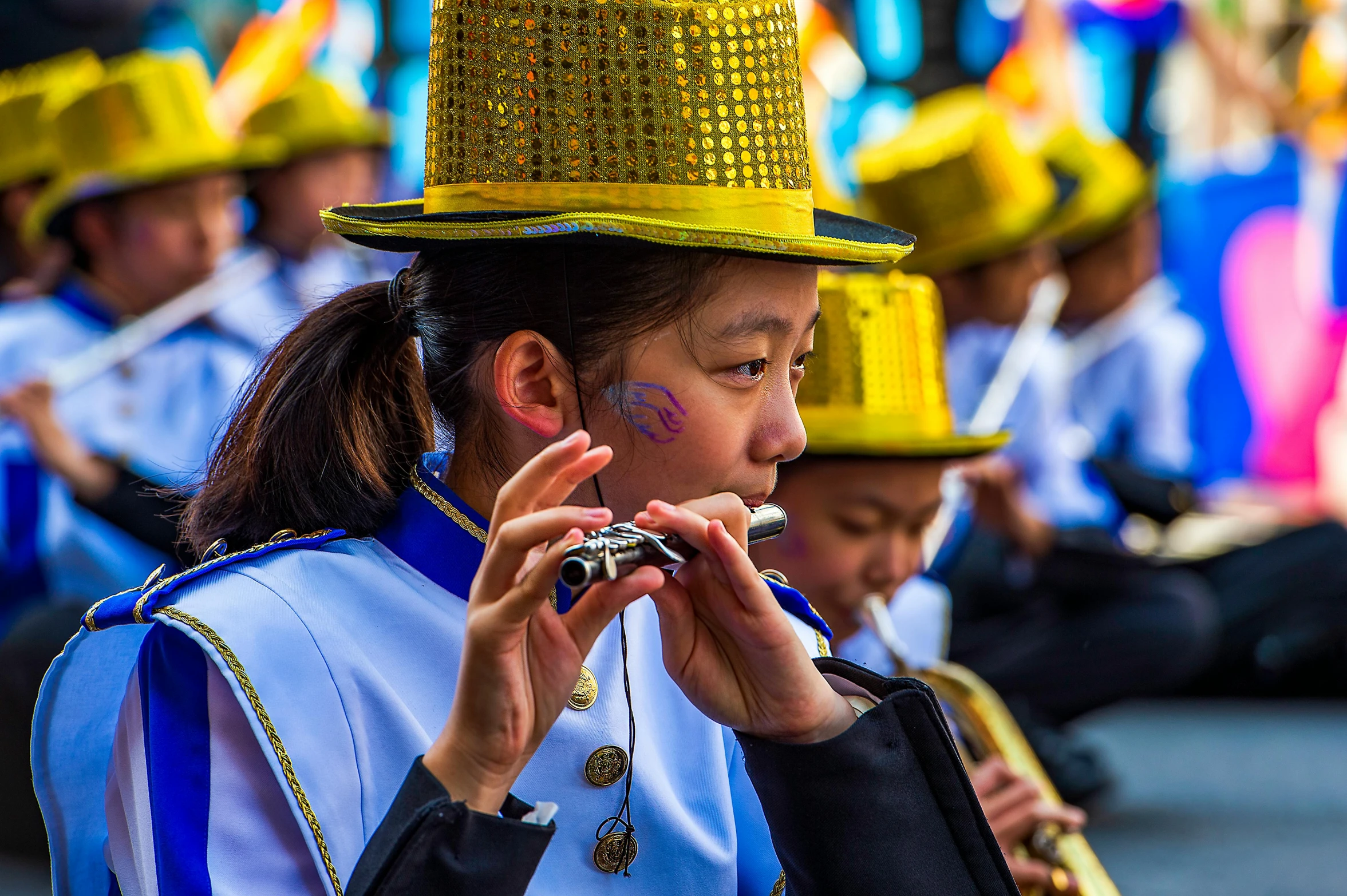 a girl with a yellow hat that is on her hand