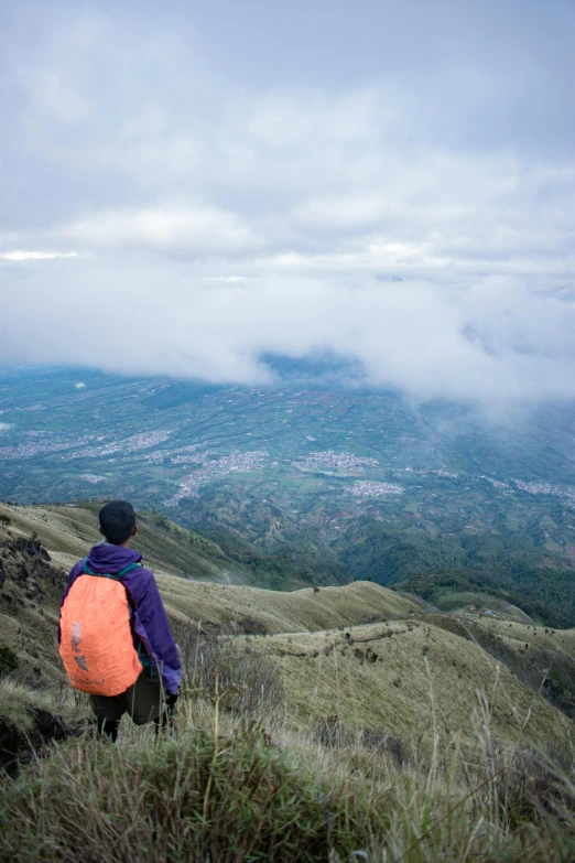 a young person looks out over the valley