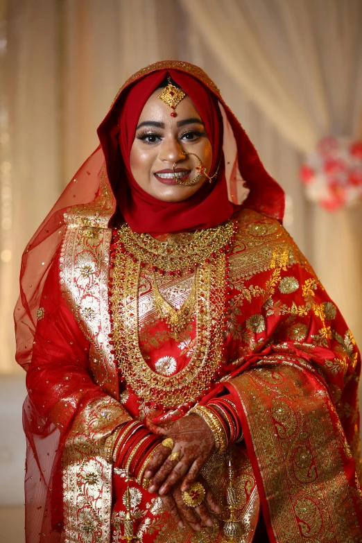 a woman dressed in a golden and red outfit