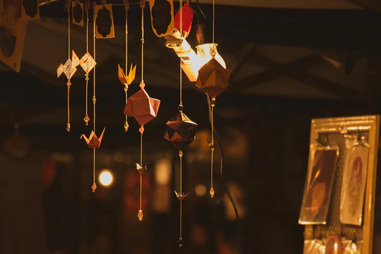 ornaments hanging from the ceiling near a picture