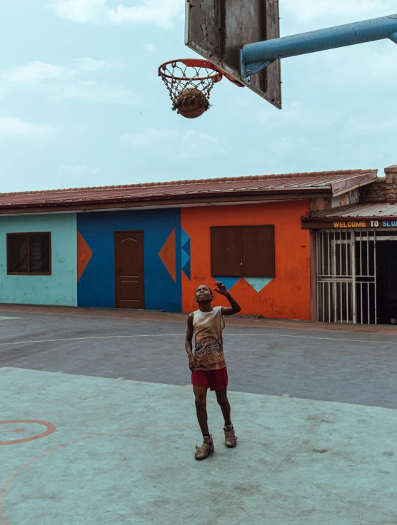 a man on the court playing with a basketball