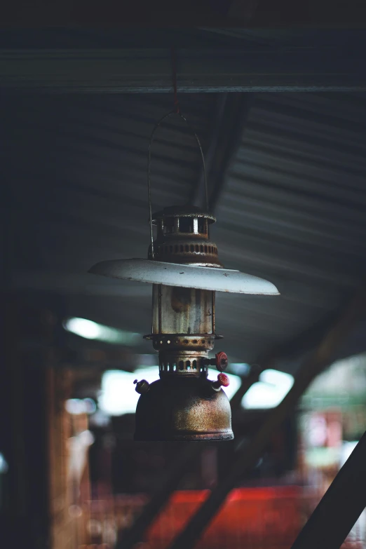 an old fashion hanging lantern in a building