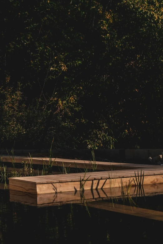 a long row of benches sitting next to water