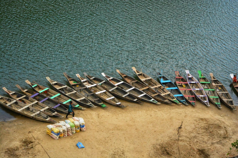 two large long boats are parked next to each other