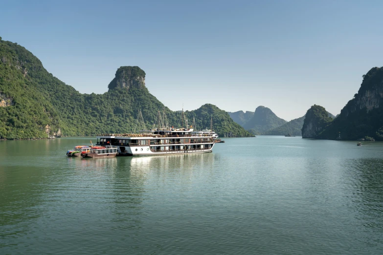 a long boat floating in a body of water