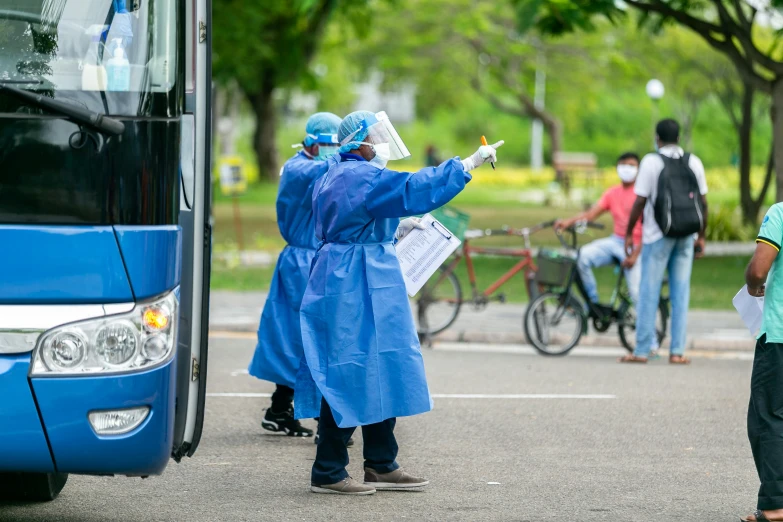 a bus and some people by the street