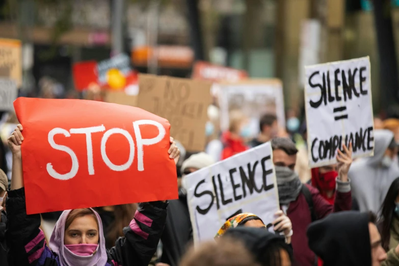 a group of people protesting at the same time