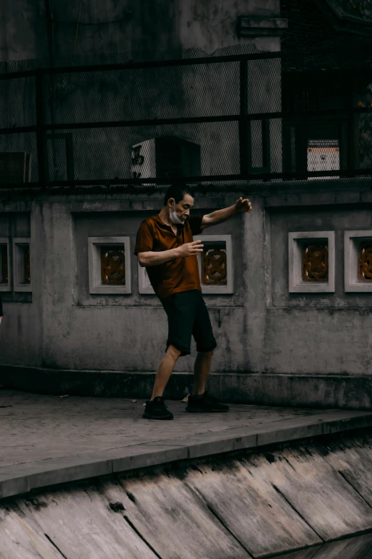 a man skateboarding down steps that are both stone and brick