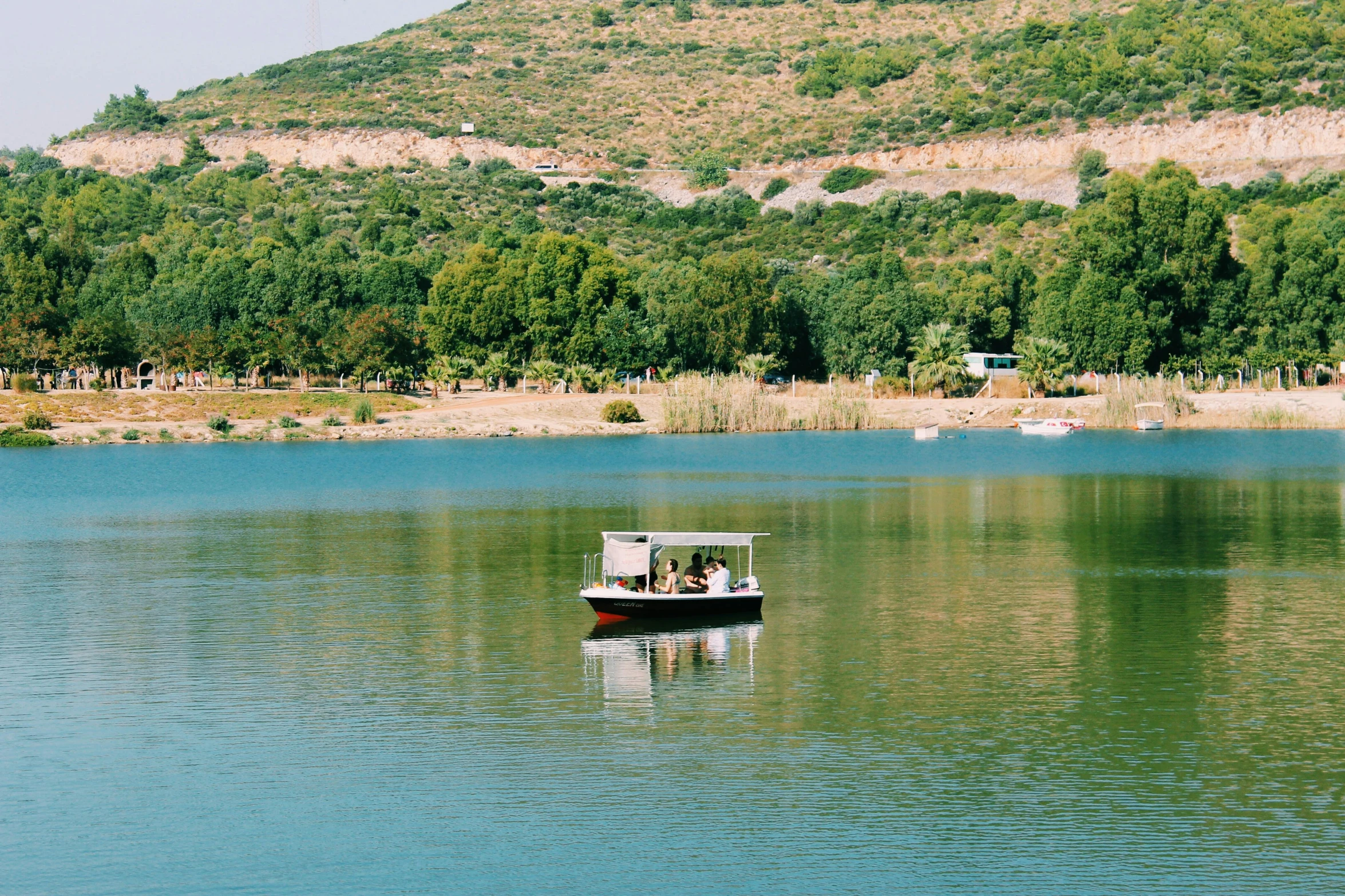 two people in a boat in the water