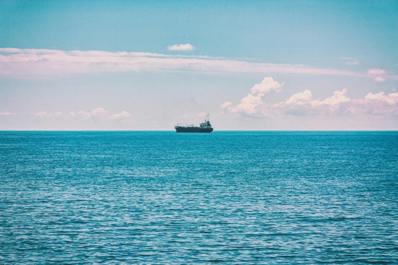 a large cargo ship floating in a body of water