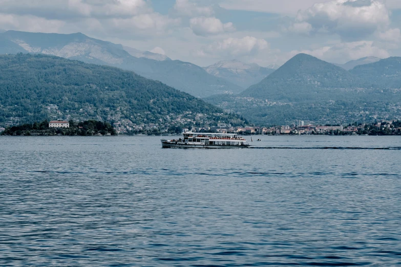 a large boat sails in the middle of a bay