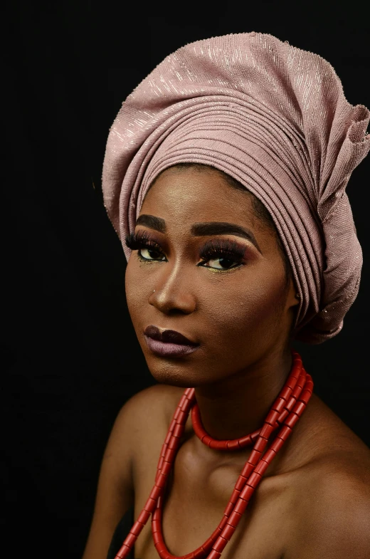 a beautiful black woman with her head in a turban