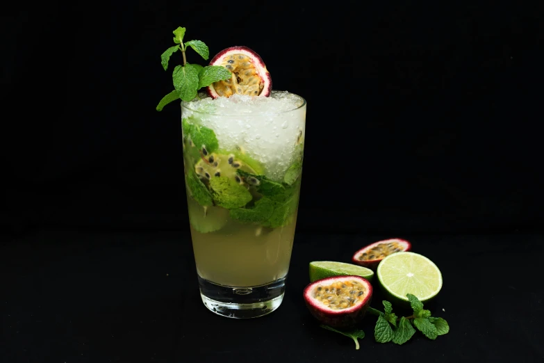 an iced drink with garnish and limes on the rim