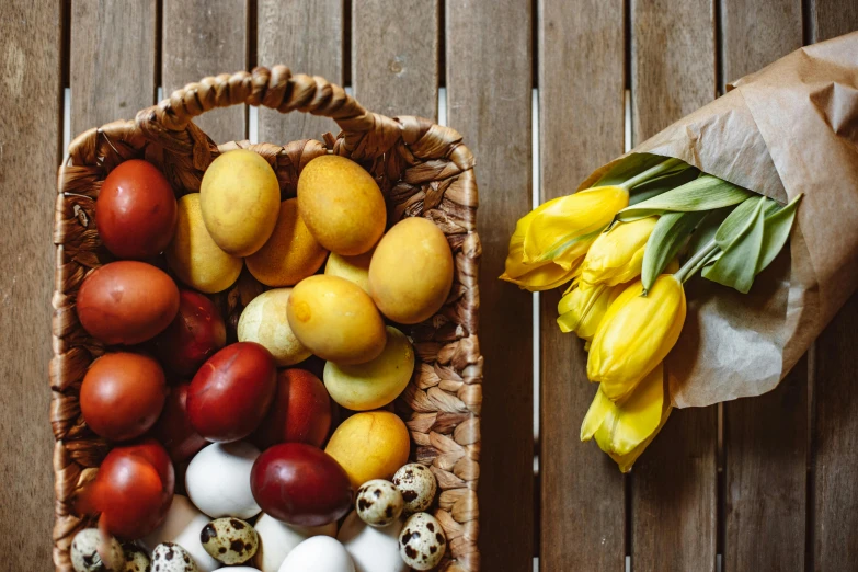 a basket filled with eggs and a yellow flower