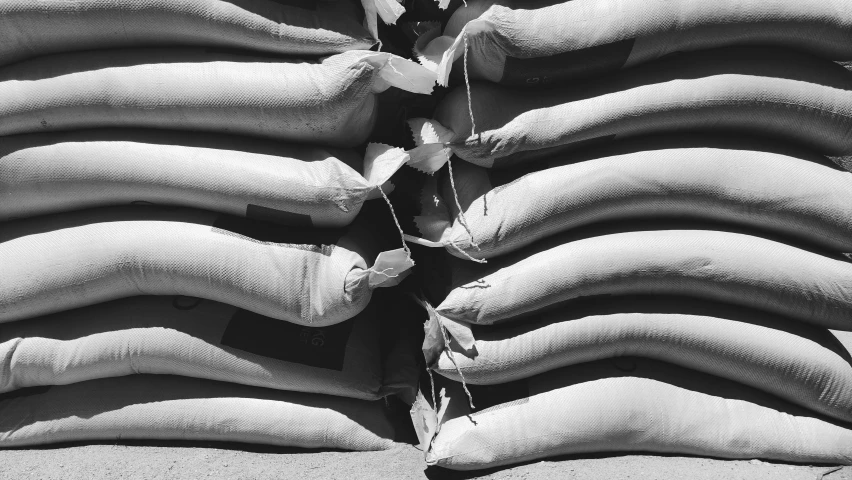 a pile of sandbags on the side of a building