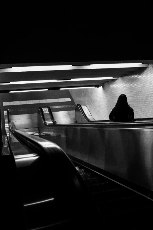 a black and white po of an escalator