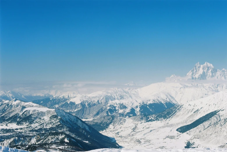 the top of a mountain covered in snow