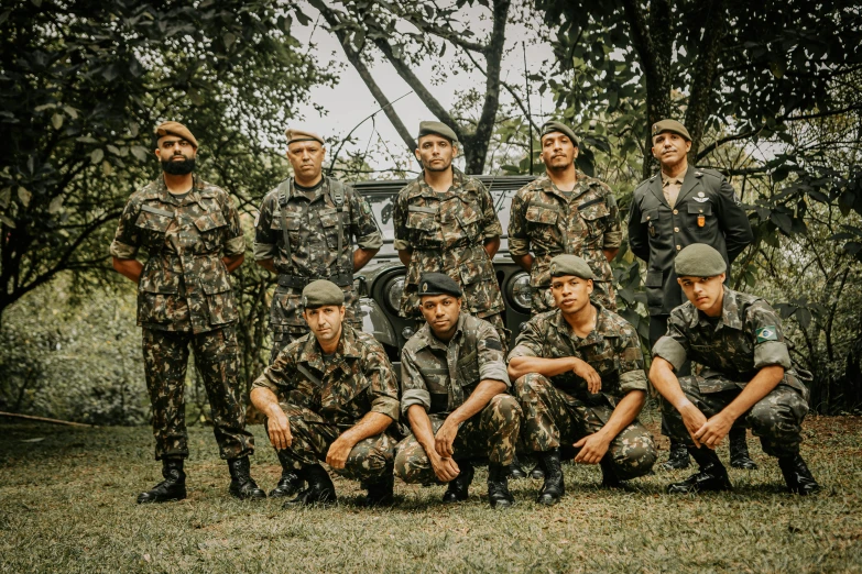 men in camouflage uniforms standing next to each other