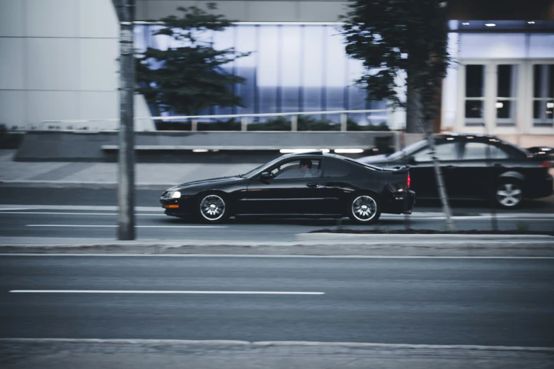 a car parked at an intersection in a city street