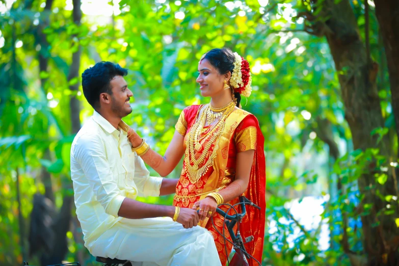 a bride and groom are sitting together and smiling