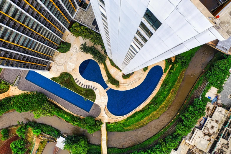 top down view of modern buildings surrounding an urban area