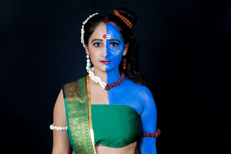 a woman in a blue outfit painted in different colors