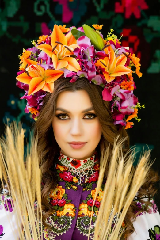a girl with flowers in her hair posing for a pograph