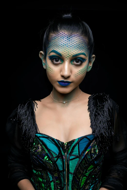 a woman with white makeup and makeup art