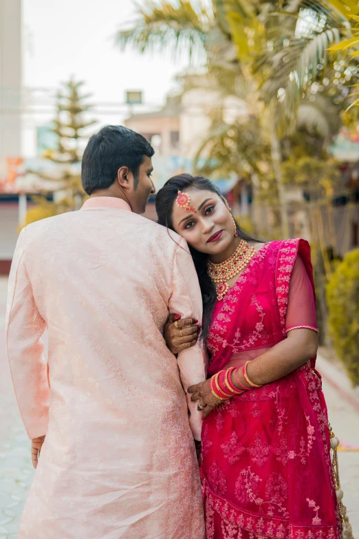 man and woman posing together for an image