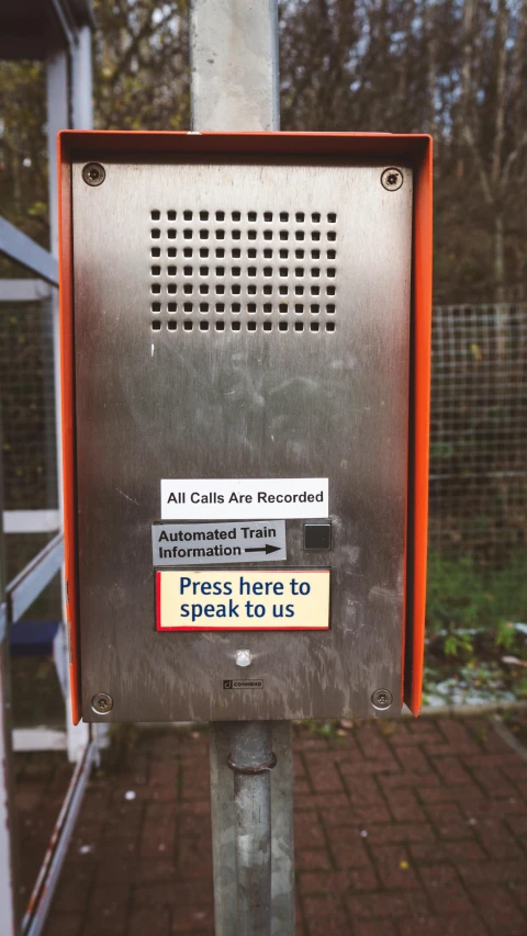 a metal enclosure with a sign that reads,