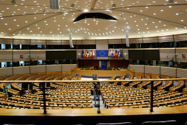 an empty room with lights and a lot of chairs