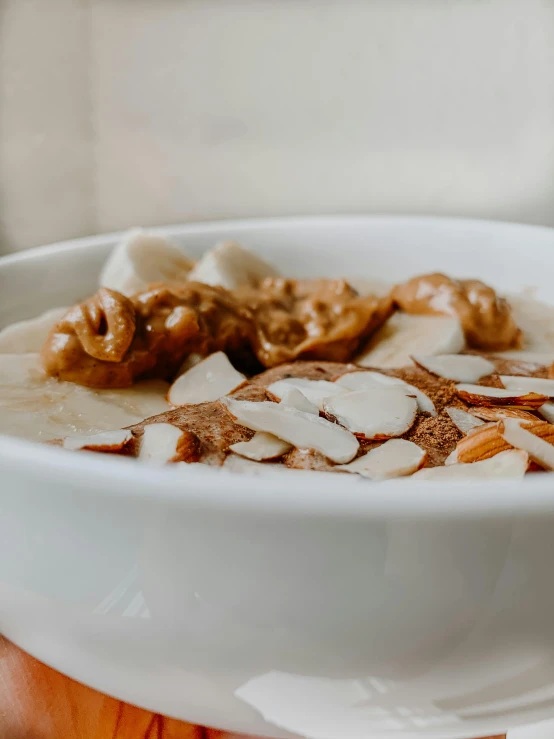 a bowl full of ding and a spoon sticking out