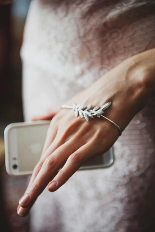 a woman is using her cell phone to take a po