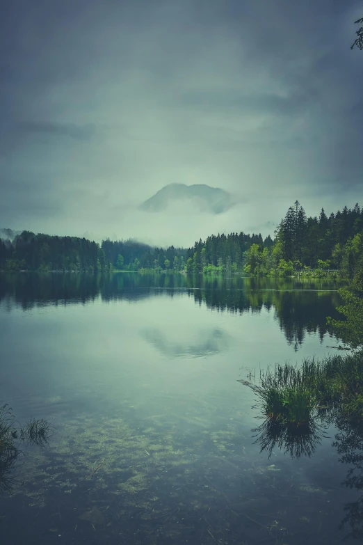 a lake is shown as clouds hover over it