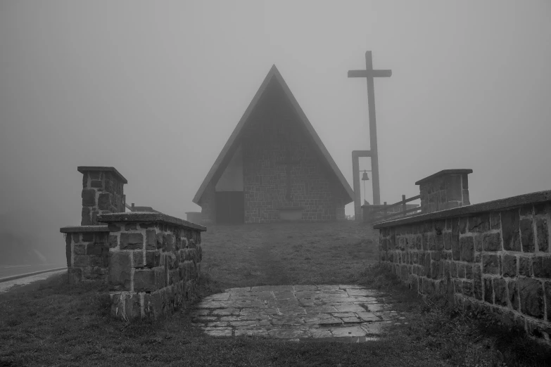 an old building with a large cross on top