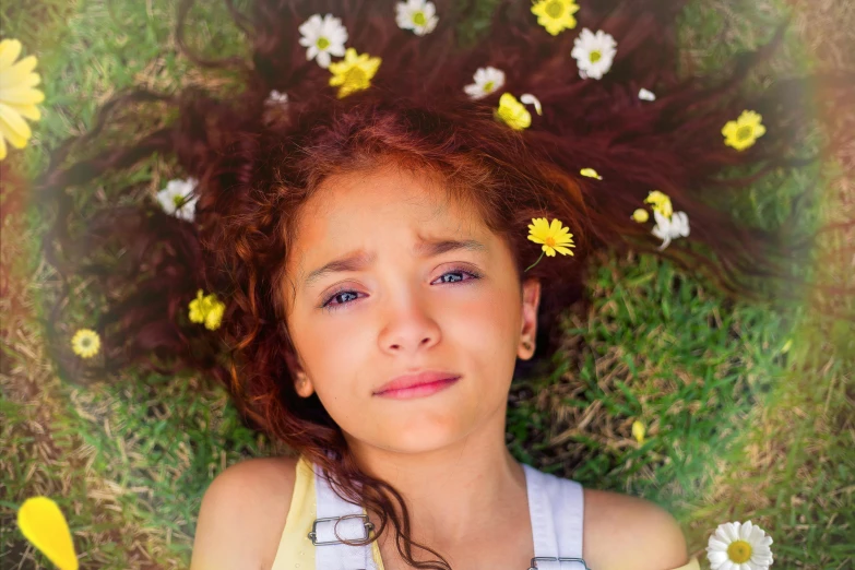 a girl with red hair and flowers on her head