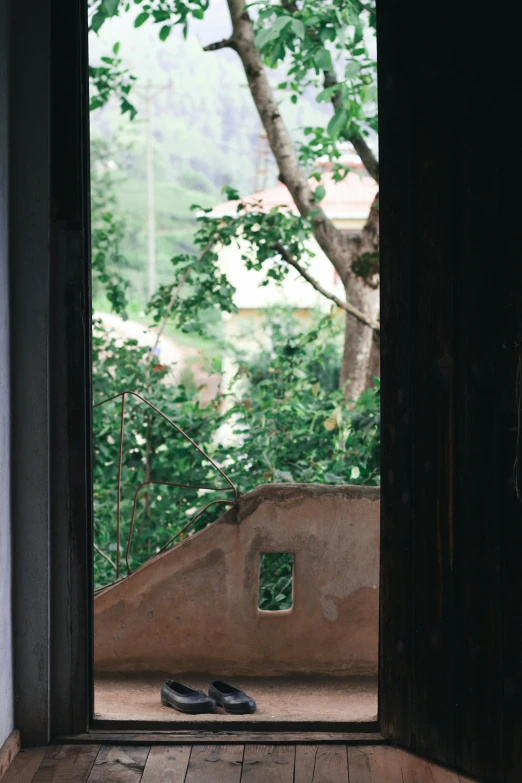 a pair of shoes are sitting on the floor outside a doorway