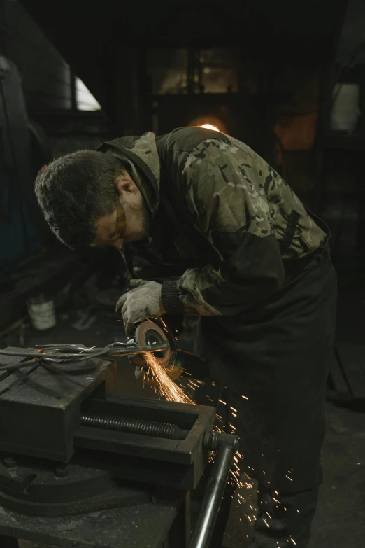 a man in the shop working on an item