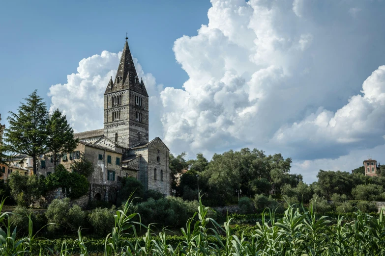 the building is on a hillside near a small hill