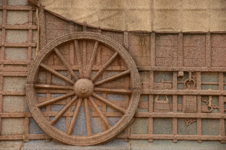 a close up image of an old cart wheel