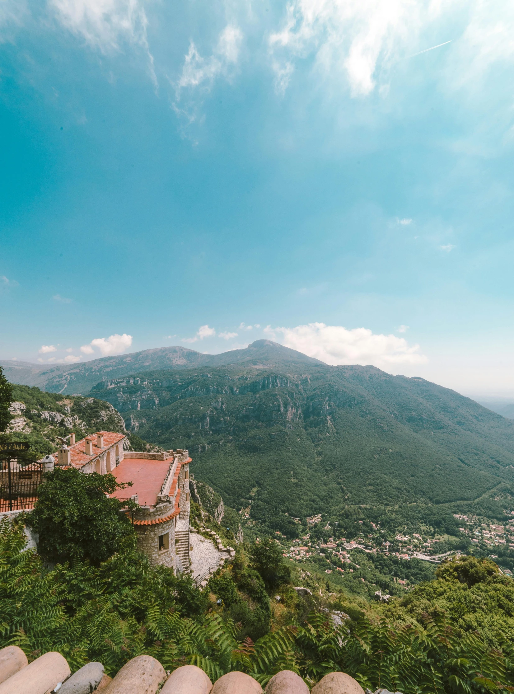 a scenic view of a mountain area with houses