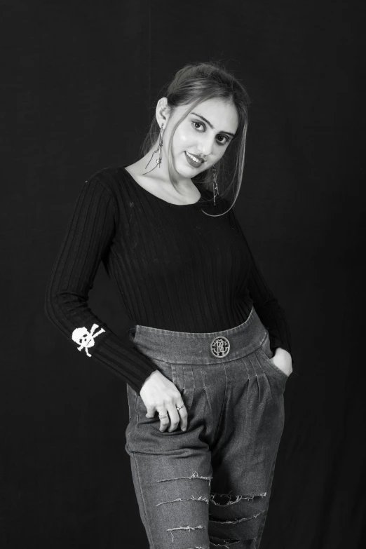 black and white po of a girl in jeans and socks