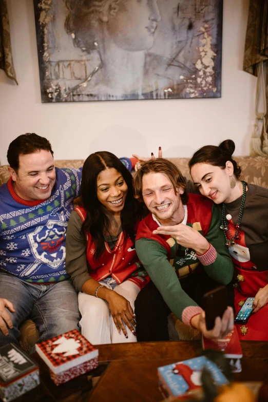 several people posing for a po in the living room