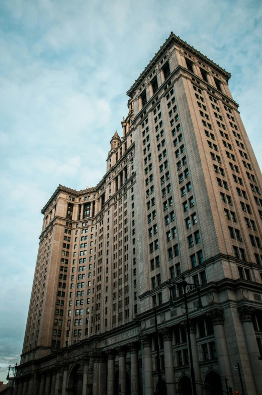 a tall building with multiple stories near a street