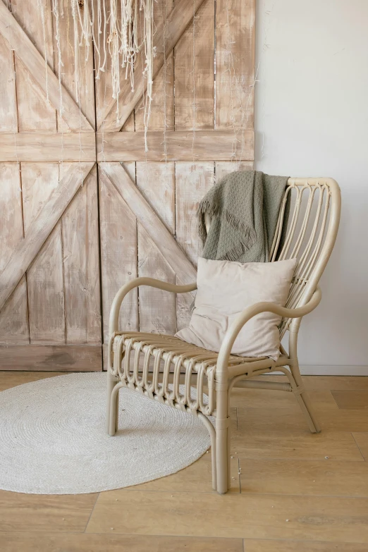 an empty chair sitting on a wood floor